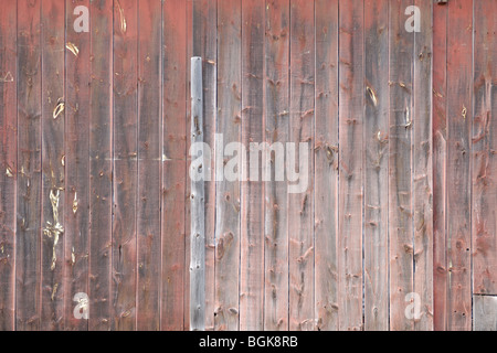 Painted in red weathered wooden boards background texture Stock Photo