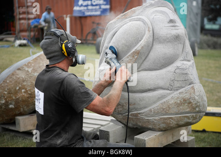 Artist makes stone sculpture New Plymouth, New Zealand Stock Photo