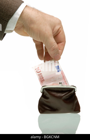 Business man pulling ten euro banknote from wallet, symbolic image for taxes Stock Photo