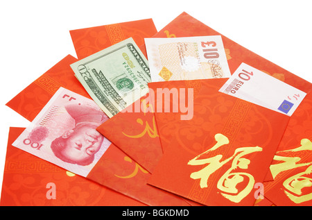 Multi national currency notes in Chinese red packets for Chinese New Year Stock Photo