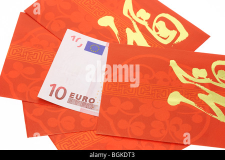 Chinese New Year red packets and Euro currency note on white Stock Photo