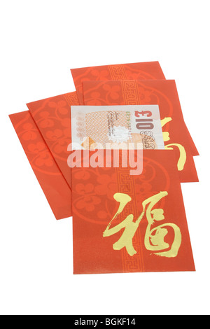 Chinese New Year red packets and British currency notes on white Stock Photo
