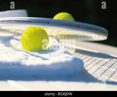 Towel tennis balls and tennis racket Stock Photo