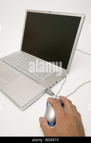 Hand using computer mouse Stock Photo