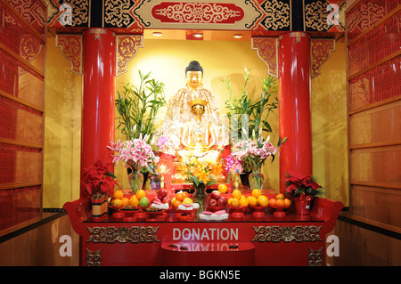 A storefront on Mott Street in Manhattan's Chinatown has been converted into a Buddhist shrine. Stock Photo