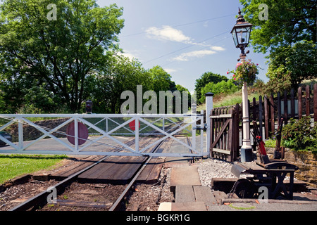 Oakworth Station on the Keighley & Worth Valley preserved Steam Railway detailing the Level Crossing and Lever Frame, Oakworth, England, UK Stock Photo