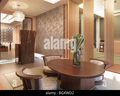 Contemporary dining room table in asian dining room Stock Photo