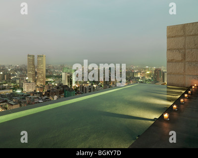 Patio and reflection pool overlooking city Stock Photo