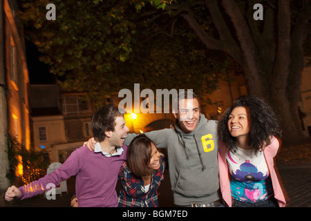 young people out at night in town Stock Photo