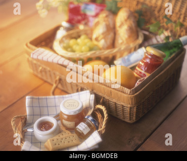 Well stuffed picnic basket with fresh fruit and bread Stock Photo
