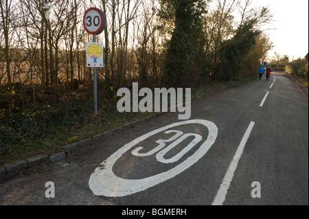 30 mph speed limit road marking on a country road near Bourne End Buckinghamshire UK Stock Photo