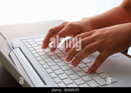 Person typing on laptop Stock Photo