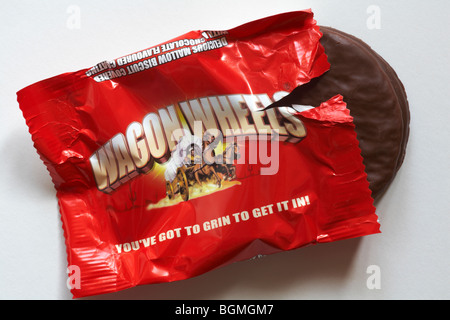 Wagon Wheels biscuits - individual packet of original flavoured Wagon Wheels biscuits set on white background - you've got to grin to get it in Stock Photo