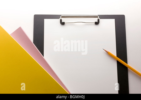 Pencil paper and clipboard Stock Photo