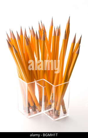 Orange pencils in container Stock Photo