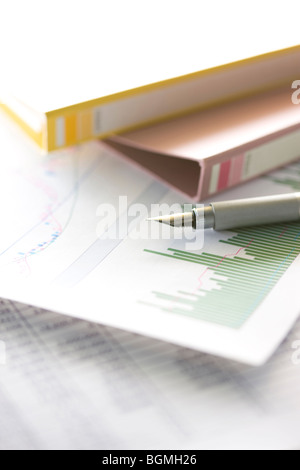 Calligraphy pen files and documents with graphs Stock Photo