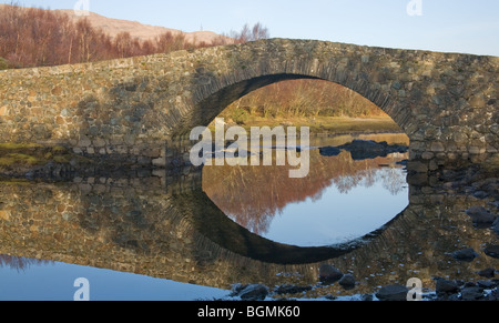 View of humpback bridge over Loch Don on the Grasspoint road Isle of Mull Stock Photo