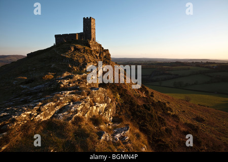 Brent Tor Church lit by the last rays of winter sunshine, Dartmoor, Devon. Stock Photo