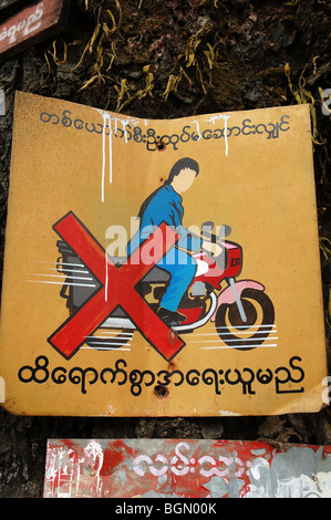 Burmese road signs and banners in Tachileik, MYANMAR Stock Photo