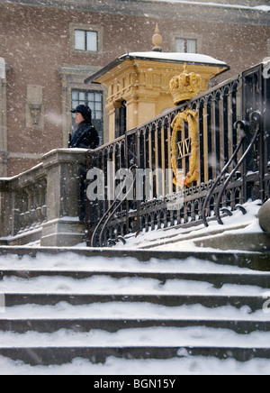 Stockholm Sweden winter. Royal Palace guard standing outside security booth. Stock Photo