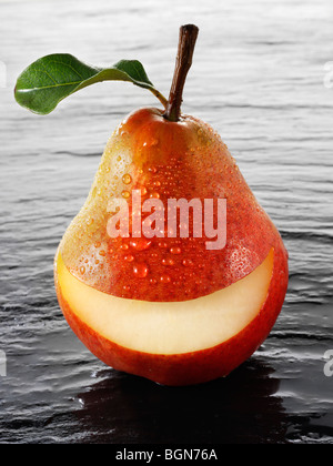 Wole Red Williams pear with a smiley face Stock Photo
