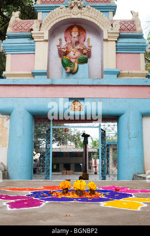 Rangoli designs in an Indian street outside a hindu temple during the festival of Sankranthi. Puttaparthi, Andhra Pradesh, India Stock Photo