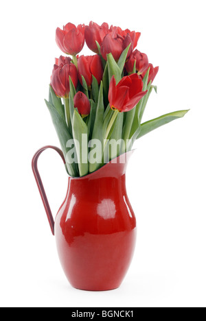 Red tulips in enamel jug Stock Photo