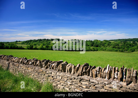 Landscape view Stone Built Cottages Naunton Village Gloucestershire Cotswolds England UK Stock Photo