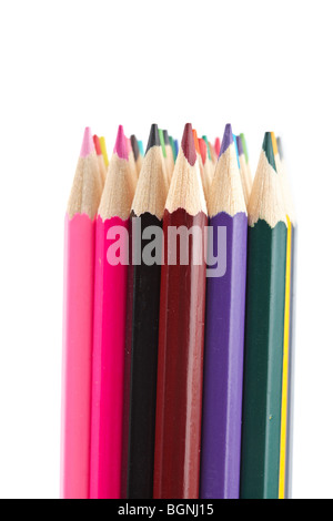 Assortment of coloured pencils isolated on white background. Shallow depth of field Stock Photo