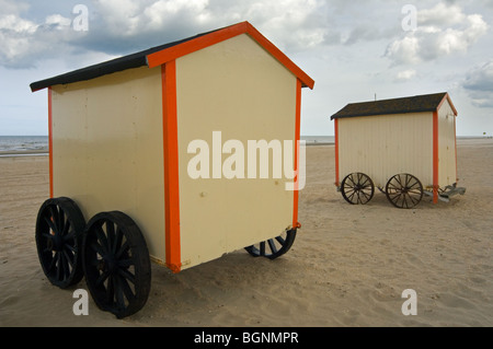 Row of colourful beach cabins on wheels along the North Sea coast at De Panne, Belgium Stock Photo