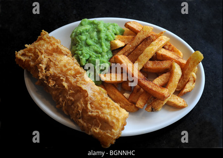 Plate of fish chips and mushy peas Stock Photo