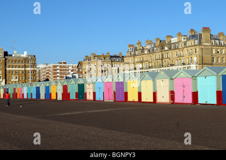 Colourful painted beach huts on the seafront at Brighton and Hove. Stock Photo