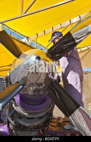 Nevada Reno Air Races P-51 Mustang race airplane mechanic in pits working on 12 cylinder Rolls - Royce engine Stock Photo