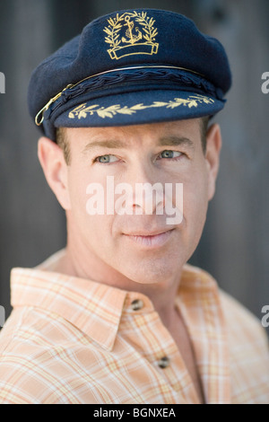 Close-up of a mature man wearing a cap Stock Photo