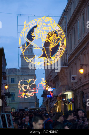 Arles, France - Feria Bullfighting Festival. Street Scene. Electric Sign Hanging Over Street with Bullfight Theme Stock Photo