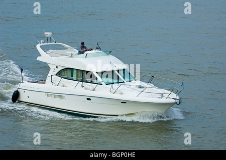 Motorboat / cabin cruiser sailing on the North Sea Stock Photo