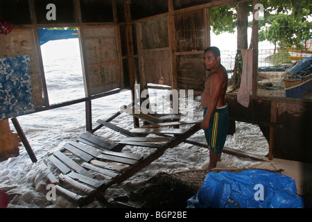 Flood damage to home, on the island of Kiribati in the Pacific Ocean Stock Photo