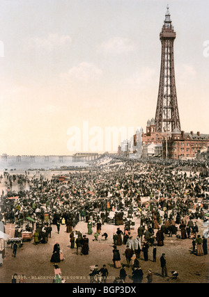 Historic photochrome colour print circa 1894 - 1900 of Blackpool Tower and packed beach. Stock Photo