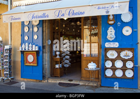 Souvenir shop with traditional faience / pottery on display for tourists at Moustiers-Sainte-Marie, Provence, France Stock Photo