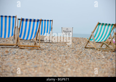 Beach safety on Brighton beach in East Sussex. A public safety sign asks 'please do not barbecue on the beach'. Stock Photo