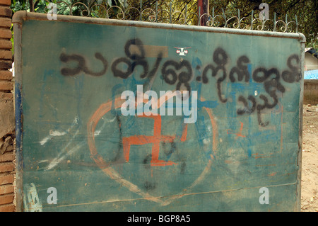 Burmese road signs and banners in Tachileik, MYANMAR Stock Photo