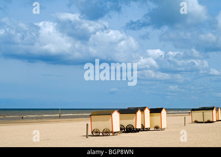 Row of colourful beach cabins on wheels along the North Sea coast at De Panne, Belgium Stock Photo