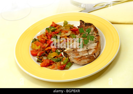 Pork chop with vegetables. Recipe available. Stock Photo