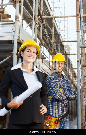 female engineer and construction worker Stock Photo