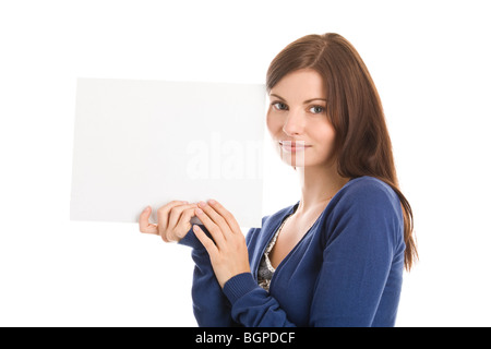 Portrait of young casual businesswoman holding blank note card isolated on white background Stock Photo