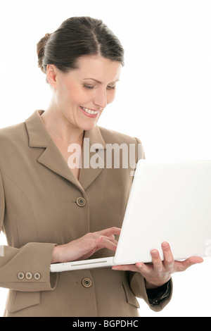 Portrait of mature businesswoman using laptop isolated on white background Stock Photo