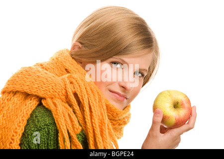 Pretty autumnal teenage girl holding ripe apple isolated on white background Stock Photo