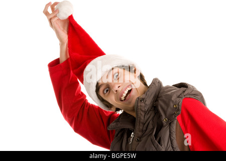 Portrait of funny christmas boy holding his cap isolated on white background Stock Photo