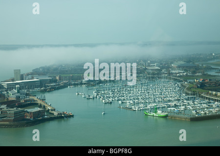 View from the Spinnaker Tower across Portsmouth Harbour to Haslar Marina, Gosport and the Isle of Wight shrouded in mist. Stock Photo