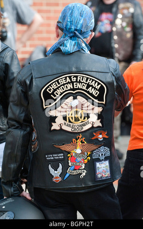 Harley Davidson biker wearing a leather jacket with emblem emblazoned on the back Stock Photo